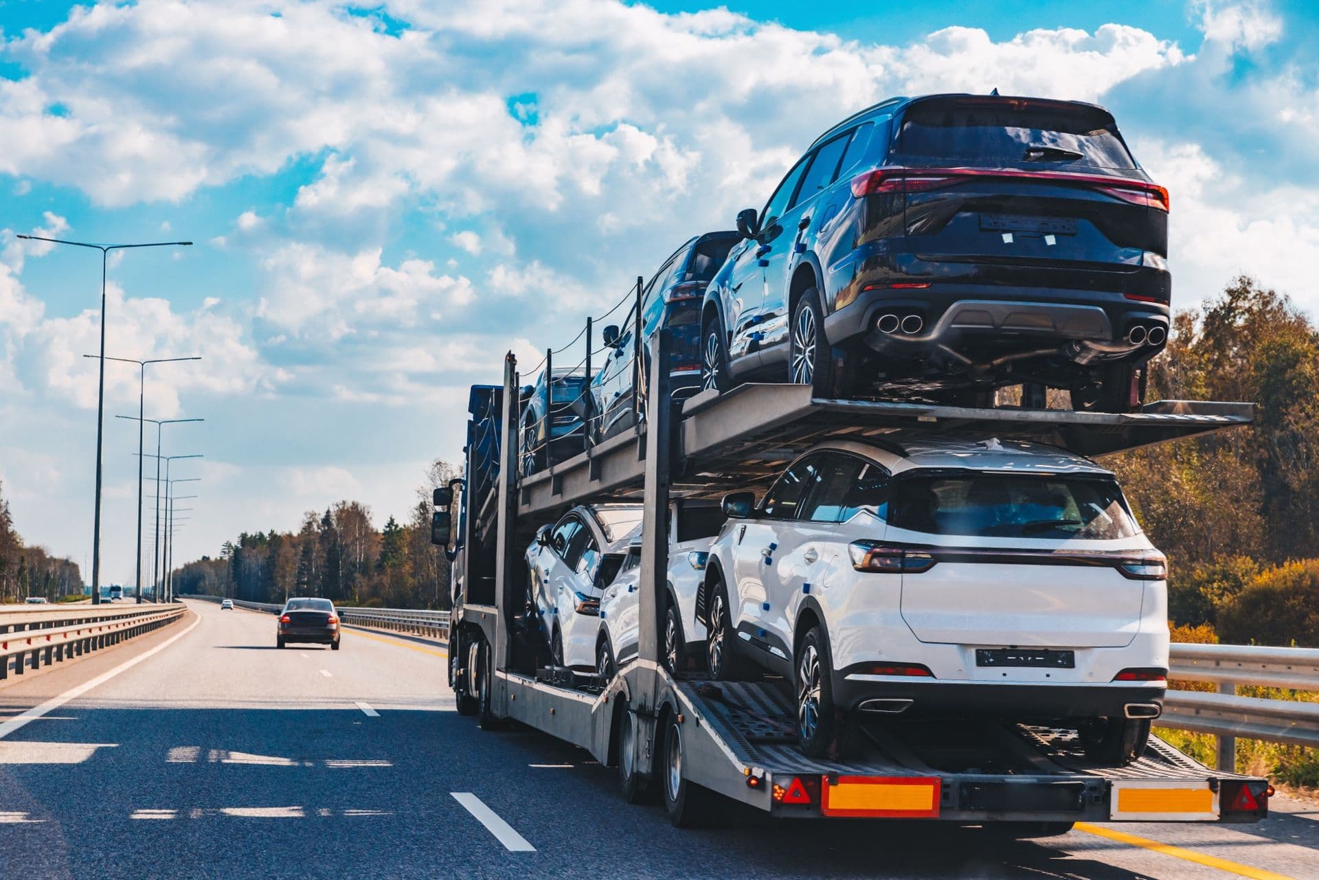 Car transporter carrying vehicles for shipping