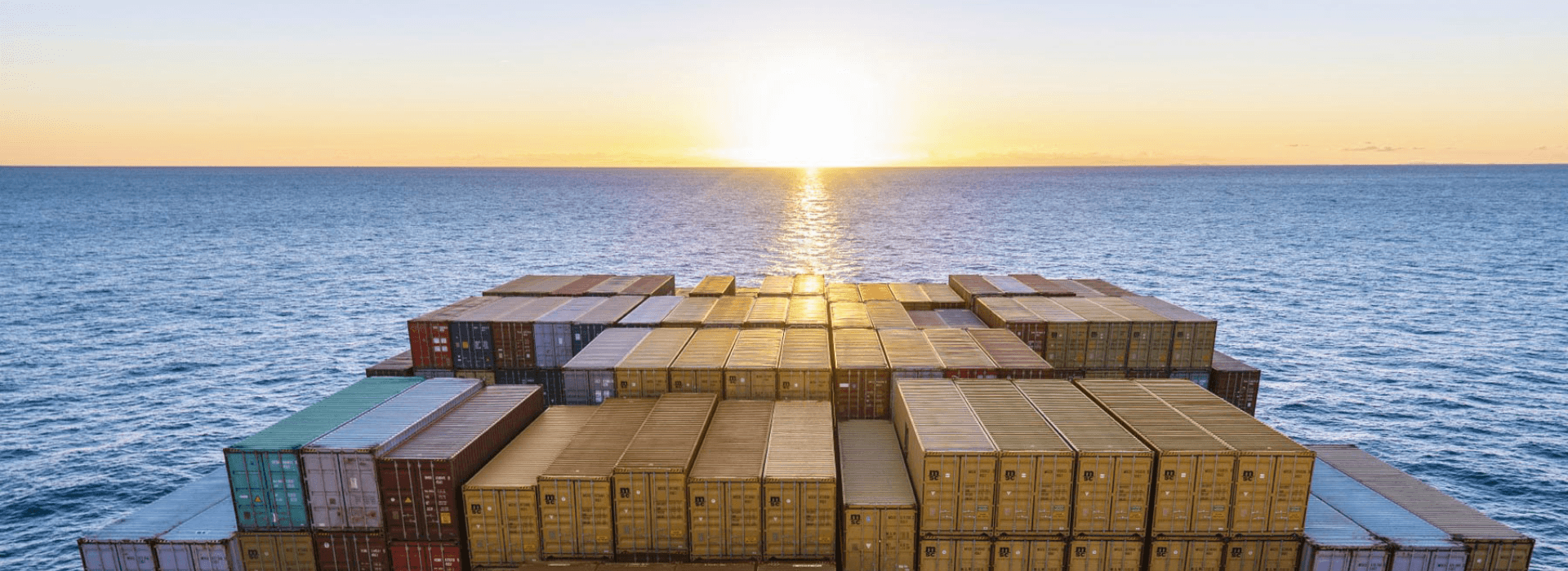 Container ship at port representing international moving by sea freight