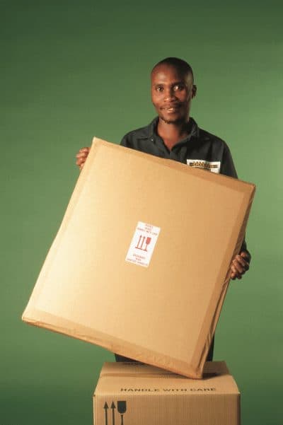 Framed oil painting secured in custom protective carton