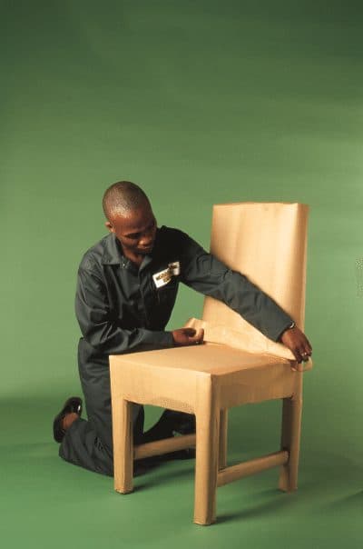 Dining chair fully wrapped in protective covering